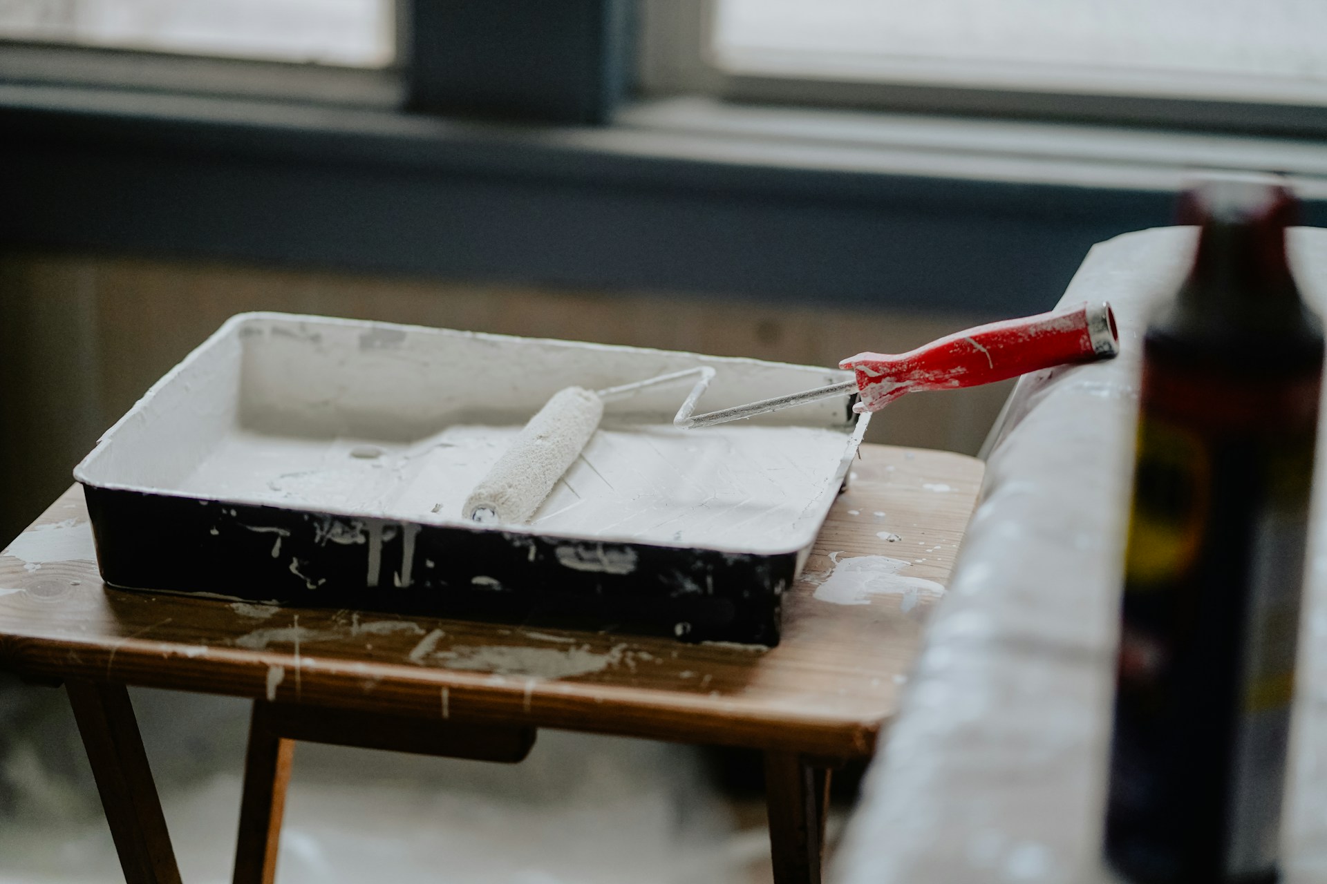 Home Renovation paint roller on a tray of paint